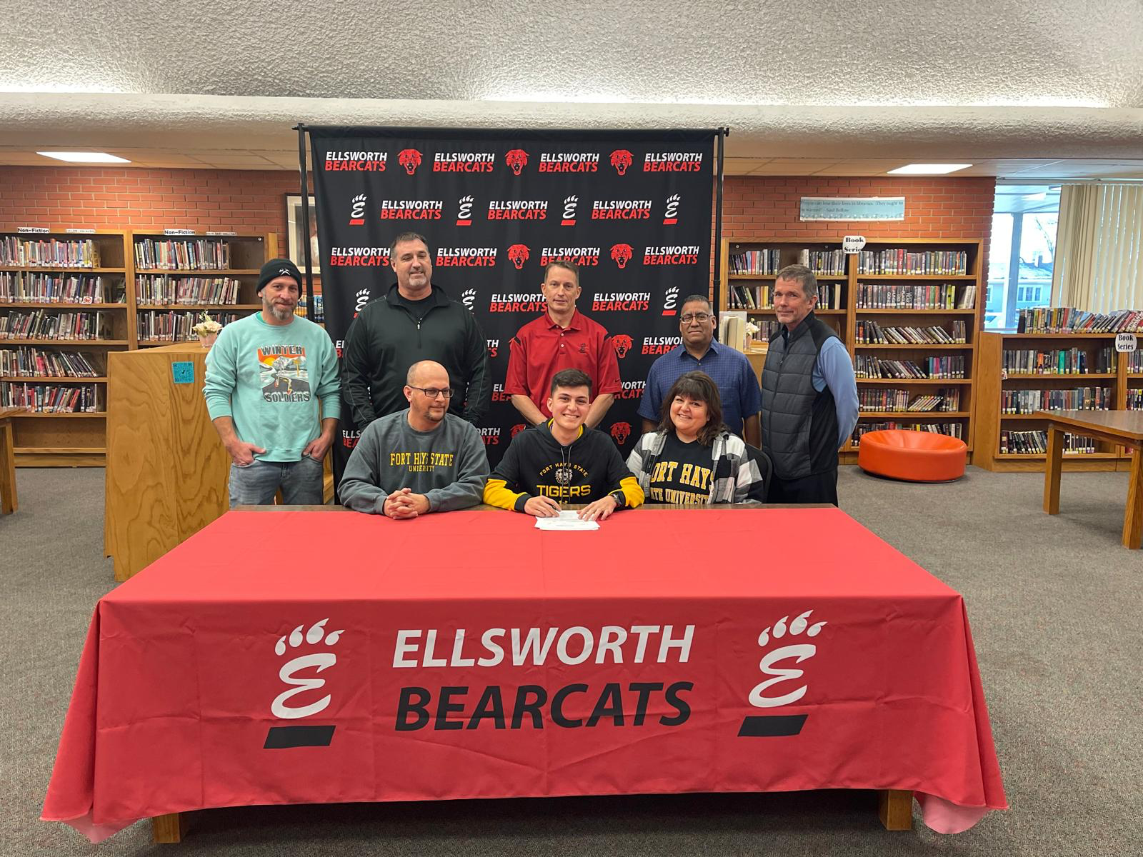 Pictured L to R: Front row: Justin Johnson (father), Byron Johnson, Amy Johnson (mother); Back row: Coaches Jake Sheridan, Steve Bolton, Eric Coonrod, Nick Rodriguez & Huey Counts